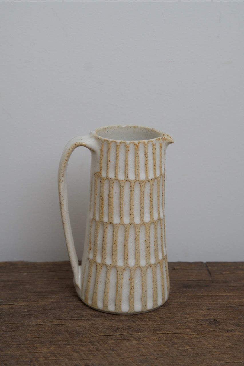 Carved pouring jugs