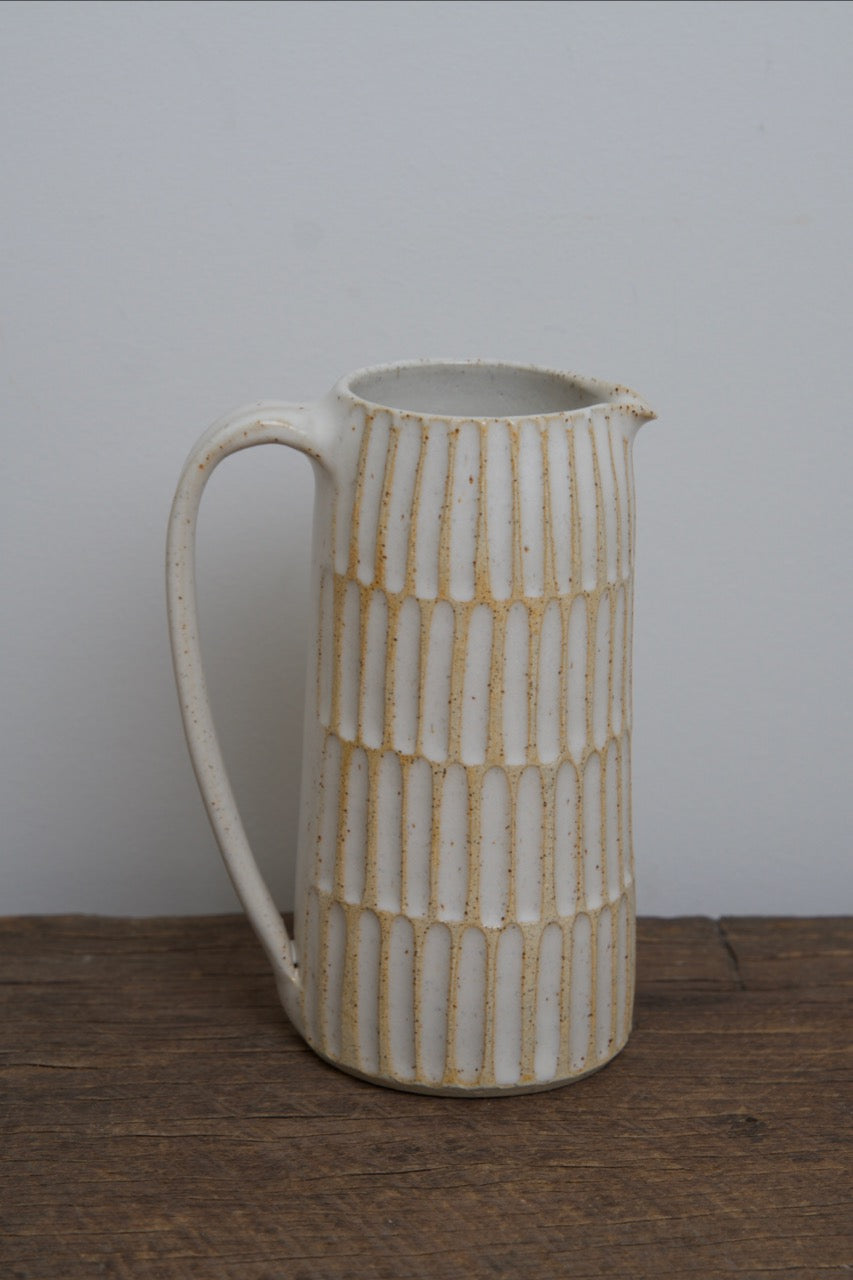 Carved pouring jugs