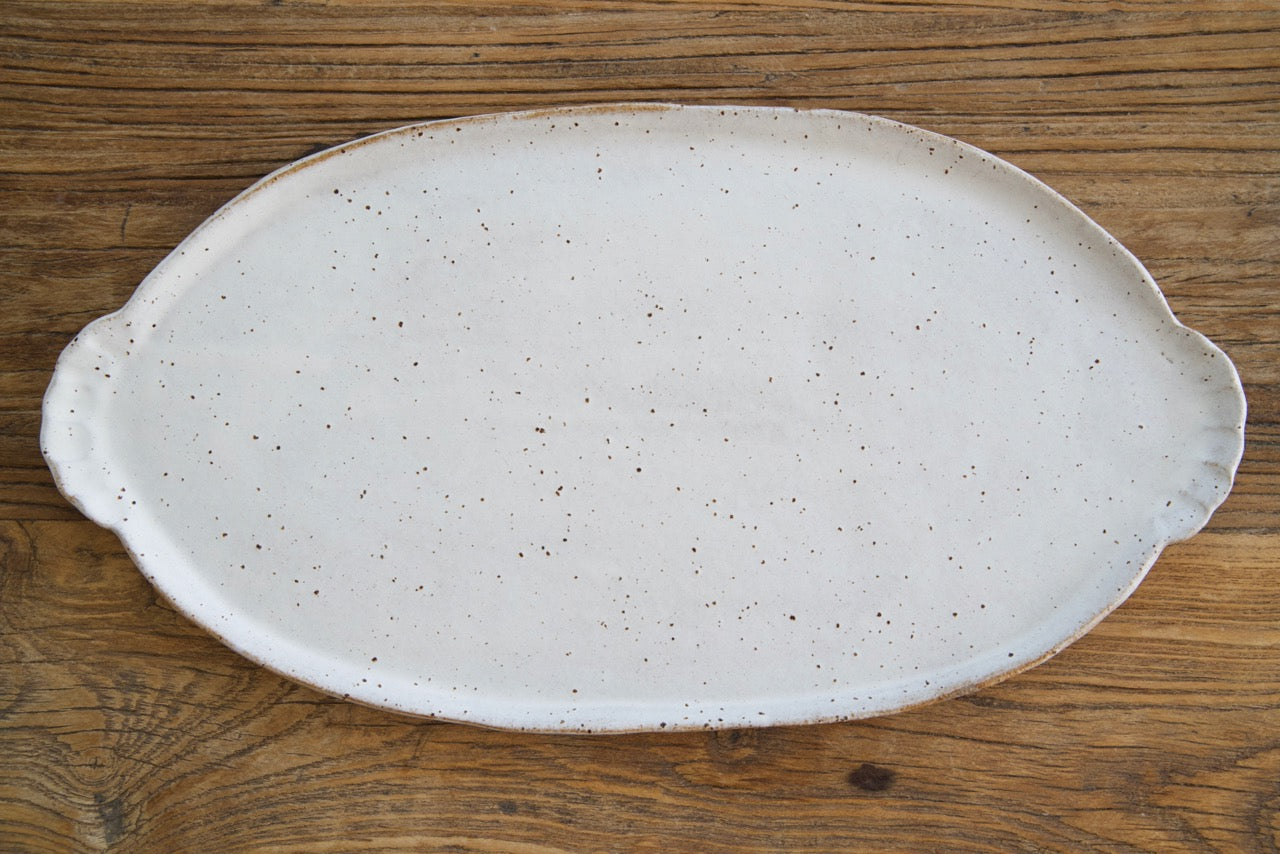 Oval platter with curly handles