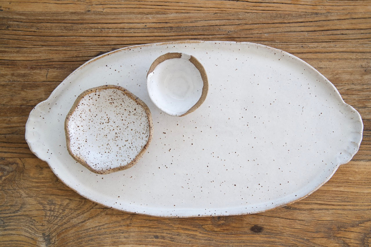 Oval platter with curly handles
