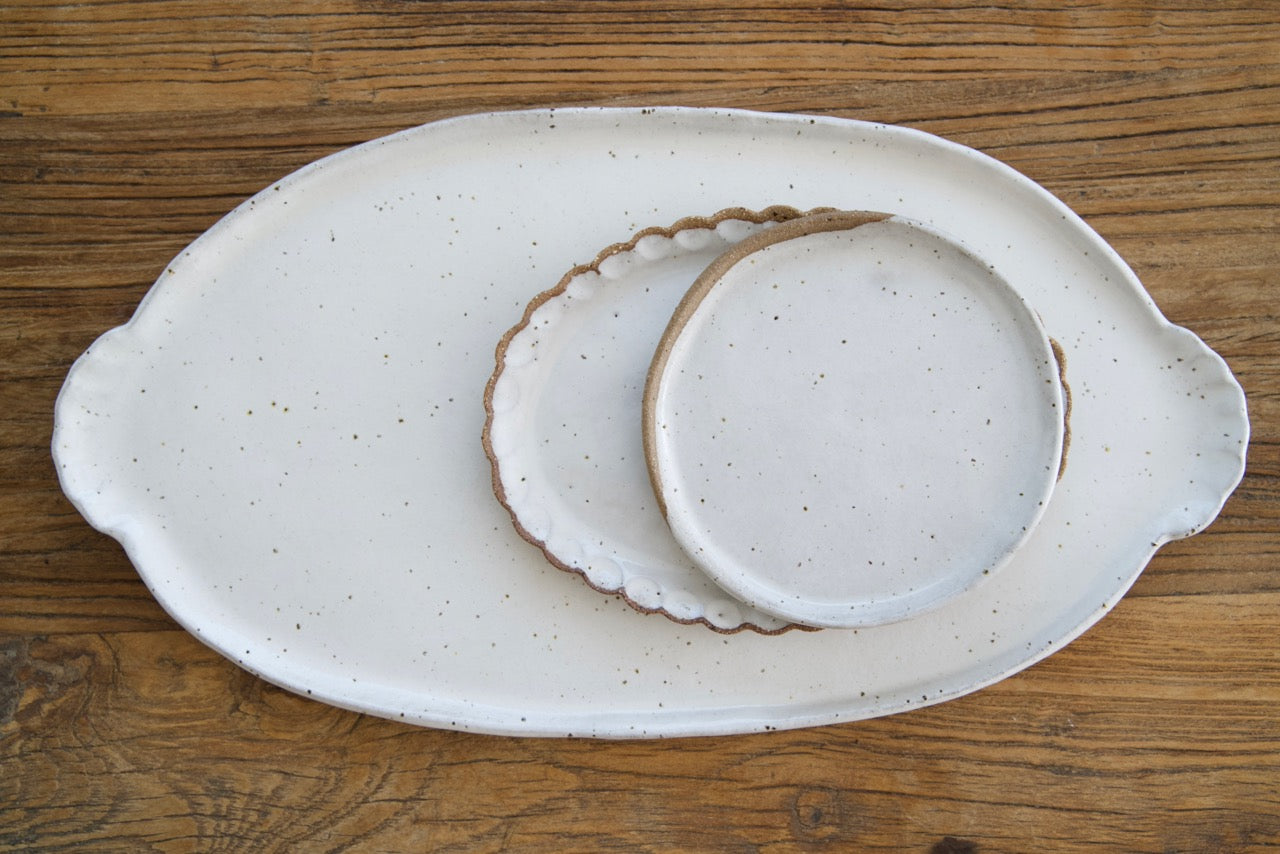 Oval platter with curly handles