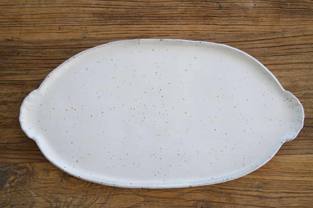 Oval platter with curly handles