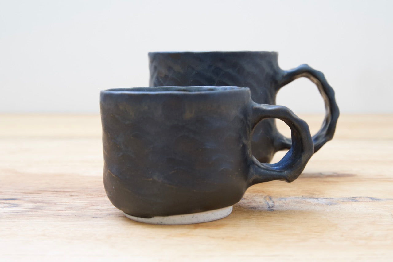 Black dinosaur mugs