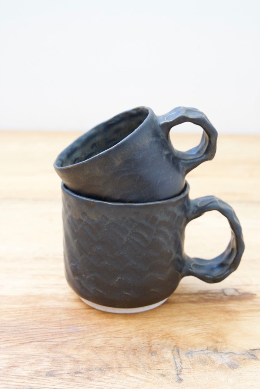 Black dinosaur mugs