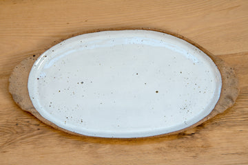Oval platter with curly handles