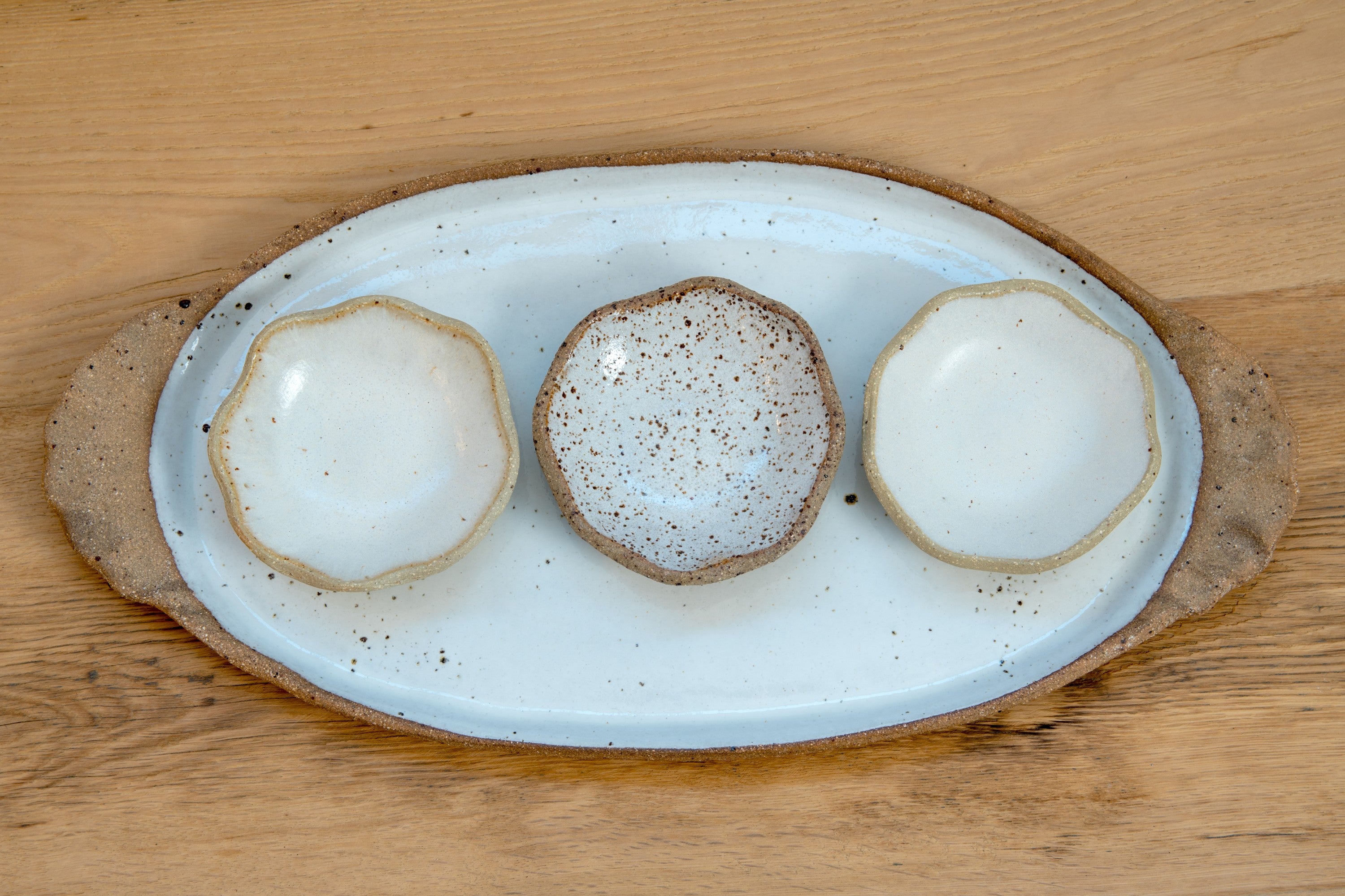 Oval platter with curly handles