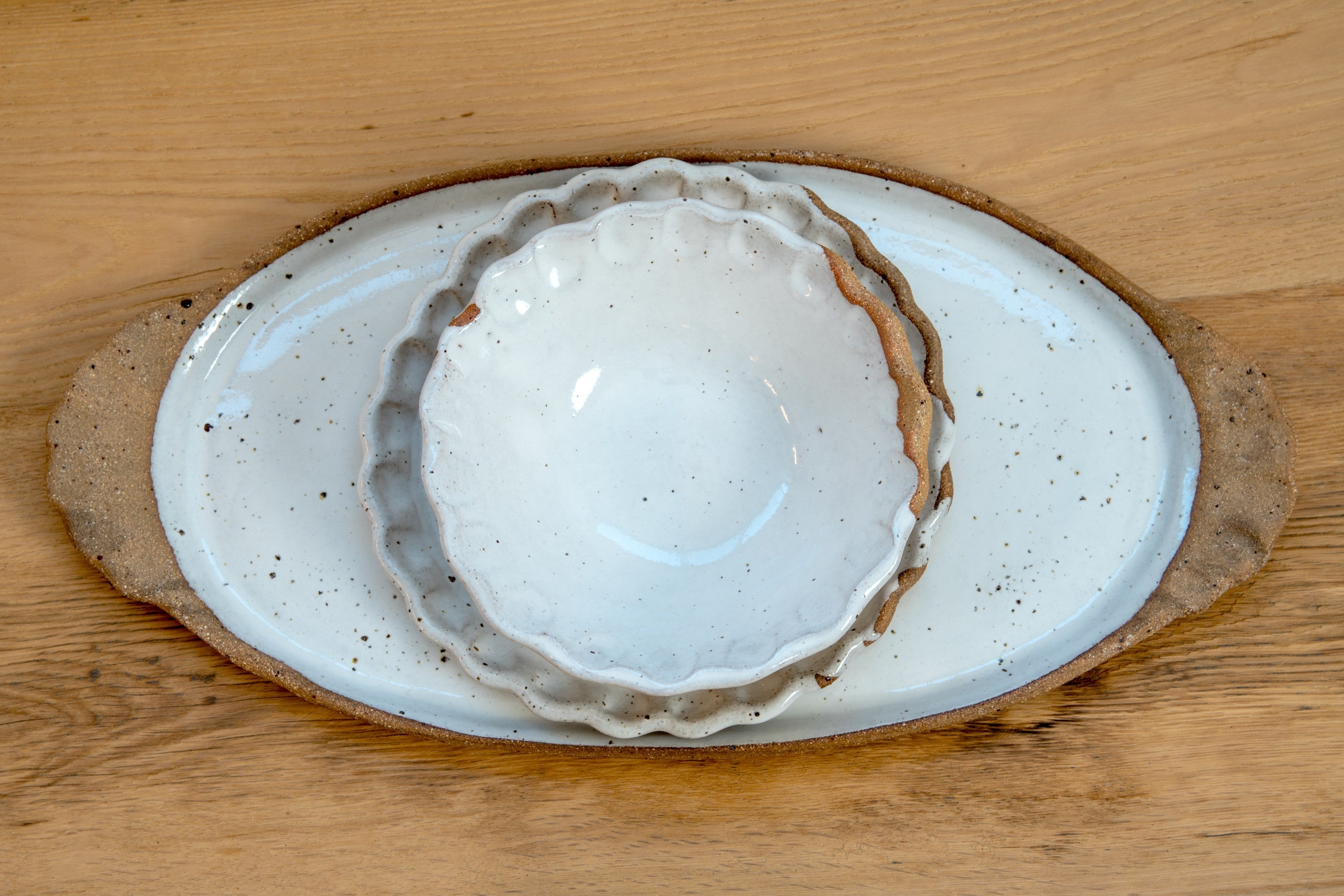 Oval platter with curly handles