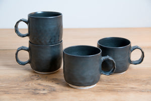 Black dinosaur mugs