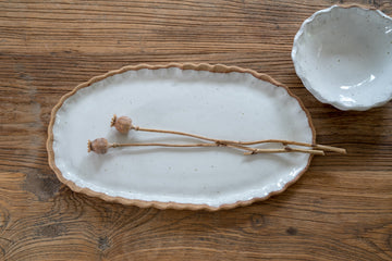 Curly rim oval platter